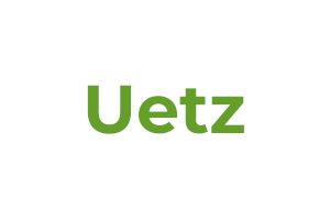 Schriftzug "Uetz" in grün auf weißem Grund